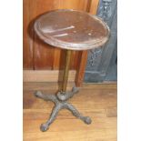 A Victorian mahogany circular top adjustable occasional table, on brass column and quadruple splay