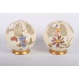 A pair of Royal Worcester blush ivory spherical pot pourri vases decorated flowers, 3" high