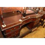 A Georgian design mahogany twin pedestal desk with inverted breakfront, fitted nine drawers, on scr