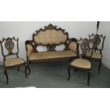 A late Victorian rosewood and inlaid salon suite comprising a two-seat settee and three side