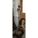 A late Victorian gilt brass Rococo design adjustable standard lamp on scroll work base