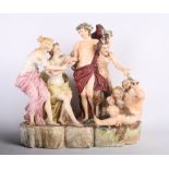 A 19th Century Capodimonte porcelain group of Bacchus and Acolytes, 15" high (restored)