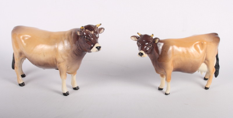 A Beswick model of a Jersey bull and cow, "Champion Dursley Coyboy" and "Champion Newton Tinkle" (