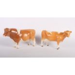 A Beswick model of Guernsey bull "Champion Sabrina's Sir Richmond 14th" and a similar cow (1451