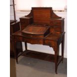 A late 19th Century inlaid rosewood writing table, fitted nine drawers and central sloping writing