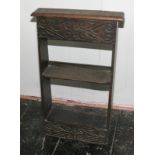 A 17th Century design carved oak three-tier wall shelf/stand with lift-up lid, 16" wide