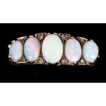A 9ct gold five stone dress ring set opals and diamonds, size N