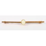 A 9ct gold bar brooch set oval opal