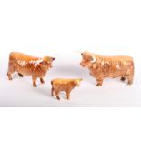 A Beswick Highland bull, a cow and a calf (1740, 2008 and 1827)