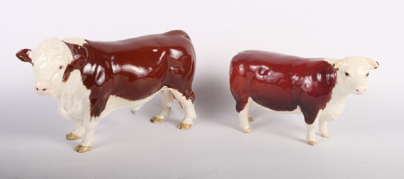 Two Beswick models of Hereford bulls, "Champion of Champions" and a similar bull and calf