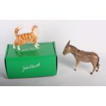 A Beswick model of a donkey and a John Beswick model of a brown striped cat