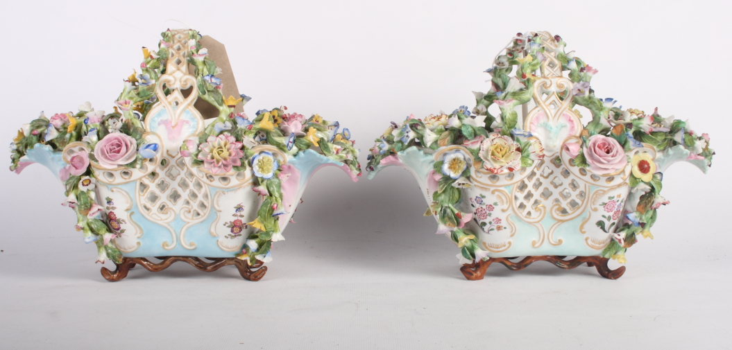 A pair of 19th Century continental porcelain flower encrusted baskets