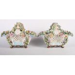 A pair of 19th Century continental porcelain flower encrusted baskets