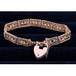 A 9ct gold gate link bracelet with heart-shaped clasp, 20.4g