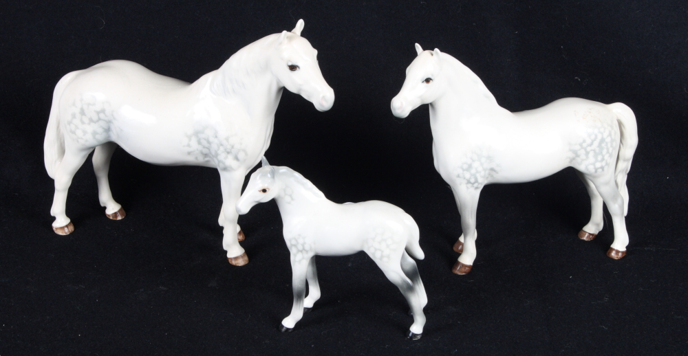 A Beswick model of a Connemara stallion, a dapple grey Welsh Mountain pony (leg restored) and a