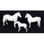 A Beswick model of a Connemara stallion, a dapple grey Welsh Mountain pony (leg restored) and a