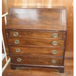 A Georgian mahogany and banded fall front bureau, the interior fitted drawers and pigeonholes over