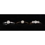 A platinum ring set solitaire diamond, size O/P, a similar gold ring set solitaire diamond, size