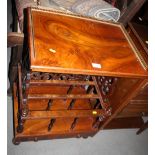 A Victorian figured walnut Canterbury with galleried top and pierced sides, fitted one drawer, on