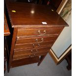 An Edwardian walnut music cabinet, fitted five drawers over shelf, on square taper supports, 21"