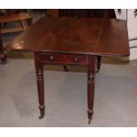 A mid 19th Century mahogany Pembroke table, on turned and fluted supports, 48" wide