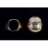 A 9ct gold signet ring set onyx, size S, and a yellow metal ring decorated scarab, size P