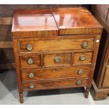 A George III mahogany enclosed top washstand, fitted three short and three long drawers, on turned