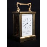 A Charles Frodsham brass cased carriage clock with presentation inscription dated 1983, 6" high