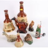Three Beswick miniatures decanters of Nessie, an otter and an eagle, three other miniature