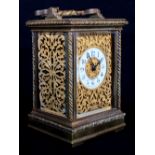 A French late 19th Century carriage clock in ornate brass case with rope twist edges, face and sides