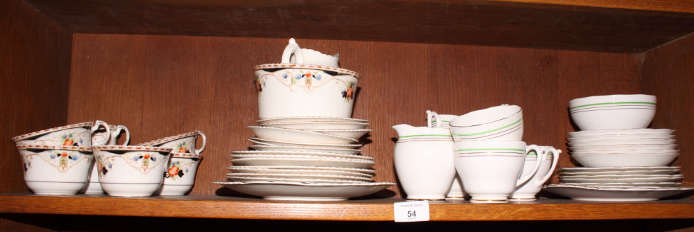 A late Victorian Melba ware floral decorated teaset for seven and a Roslyn green and silver banded