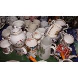 A collection of mainly late 20th Century Royal commemorative ware mugs, cups and plates, etc