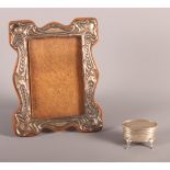 An Edwardian silver mounted photograph frame and a silver ring box with engine turned decoration