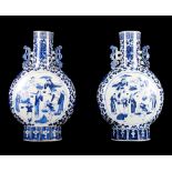 A pair of Chinese blue and white porcelain moon flasks, sides painted panels of figures, 15" high