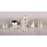 A silver three-piece cruet, a silver tea caddy, a pair of plated sugar tongs, a pill box and a