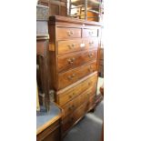 A George III mahogany chest on chest of two short and six long drawers fitted brass loop handles, on