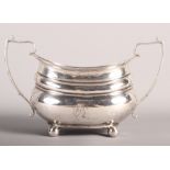 A silver two-handled sugar bowl with gadrooned border, 9oz troy approx