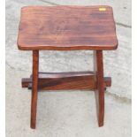 An elm panelled stool and two string seat stools