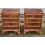 A pair of yew and banded bedside chests of two small and three long drawers, on bracket supports,