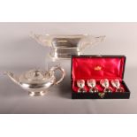 A silver plated two-handled dish, a plated teapot and four goblets, in box