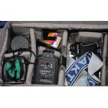 A Panasonic NV-M5 video camera, in carry case, and a collection of assorted cameras and other