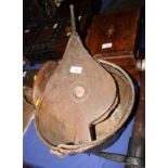 A copper pan and a pair of bellows