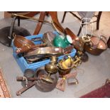 A collection of brass, pewter and copper, etc, to include pans, trays, a trivet, a chamber stick,