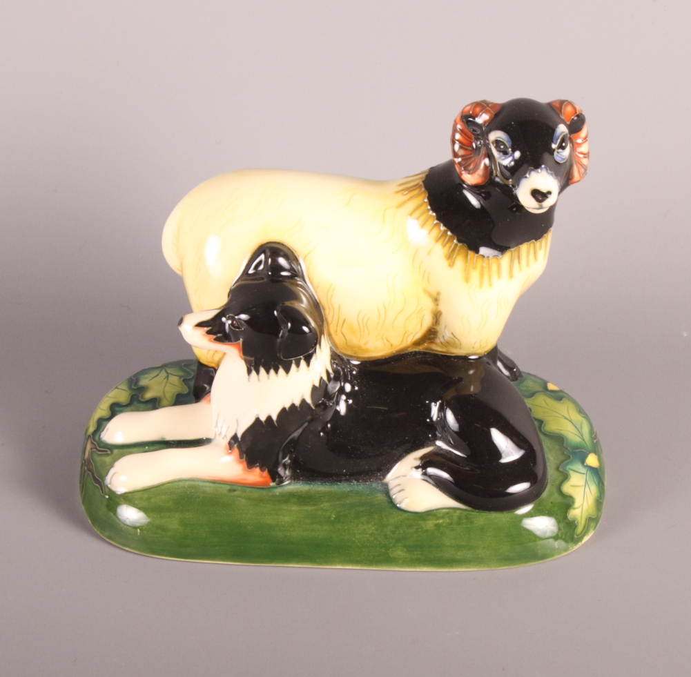 A Moorcroft model of a sheep and sheep dog, circa 2007, in original box