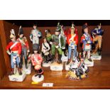 An assortment of modern glazed and bisque ceramic figures of soldiers