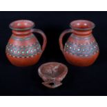 A Roman Samian ware pottery oil lamp moulded figure and a pair of early Pratt ware terracotta