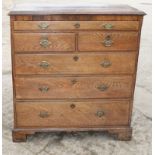 An 18th Century oak and walnut banded chest of one shallow, two small and three long graduated