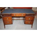 A mid 20th Century twin pedestal desk with blue leather top, fitted five drawers, 55" wide