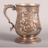 A Victorian silver christening mug with embossed decoration, 4.7oz troy approx