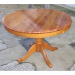 A pine single pedestal dining table with leaf, 42" dia